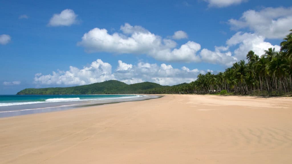 White sand beaches and blue skies and white clouds as one of the beaches in southeast asia