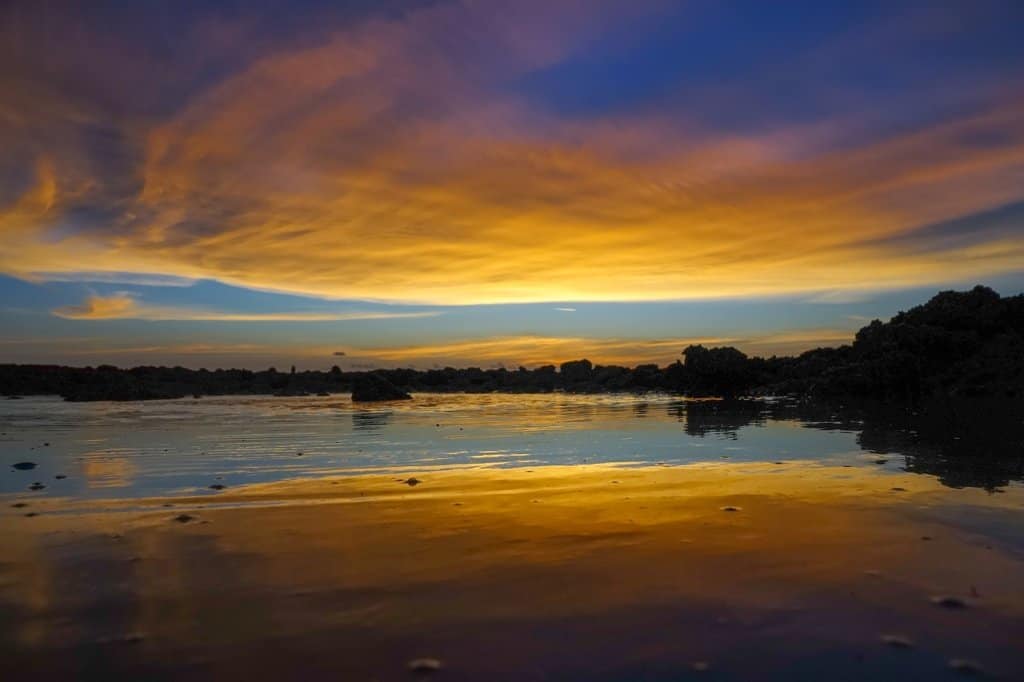 A sunset on a beach in Darwin Australia