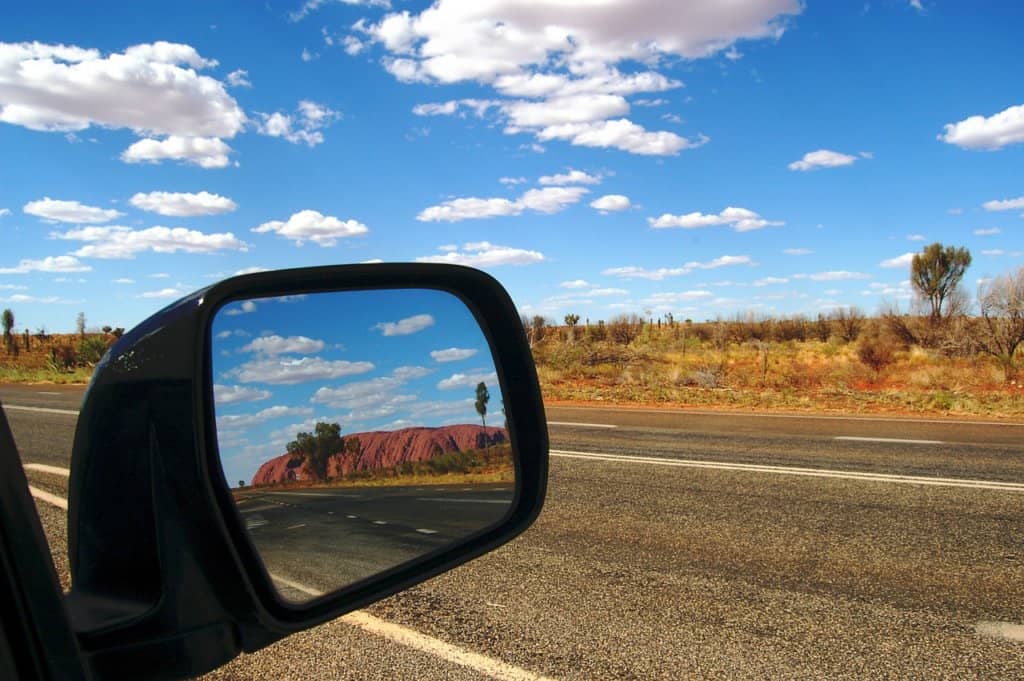 car mirror showing the landscape 