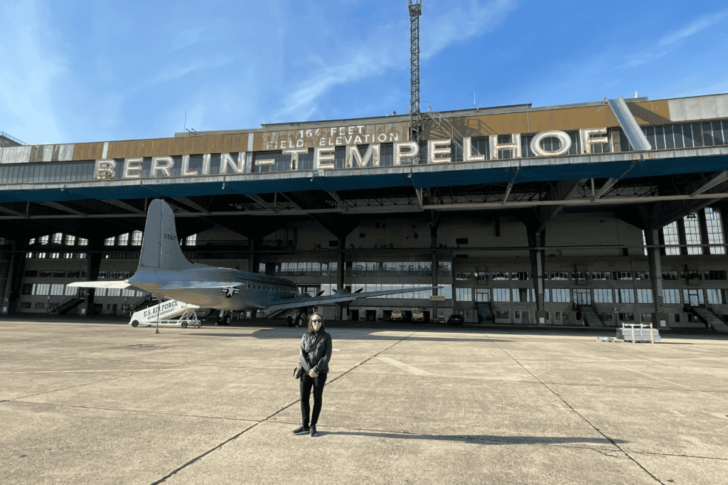 woman standing on an airfiield at berlin tempelhof