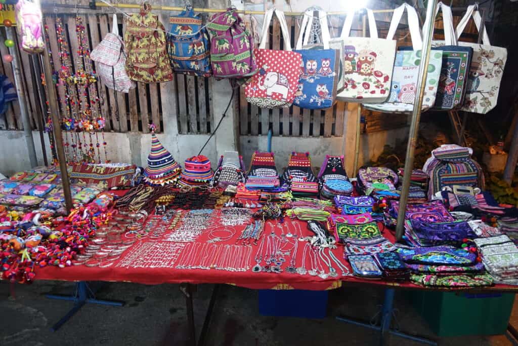 Table with local thai purses and jewelry for sale