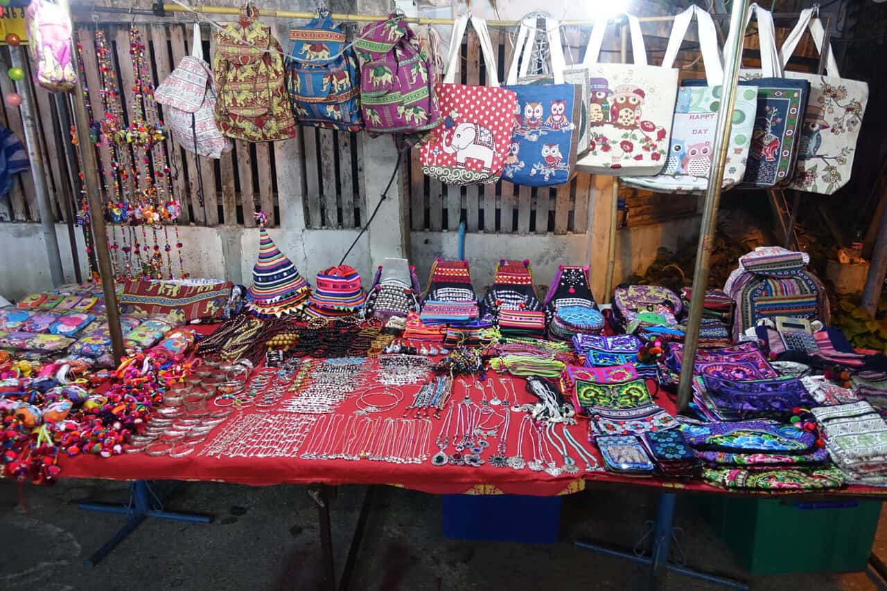 Table with local thai purses and jewelry for sale at the night bazaar in chiang mai 