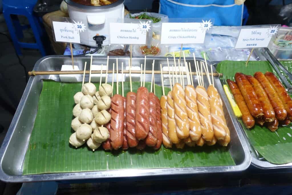 Three different types of rolled meat on a stick