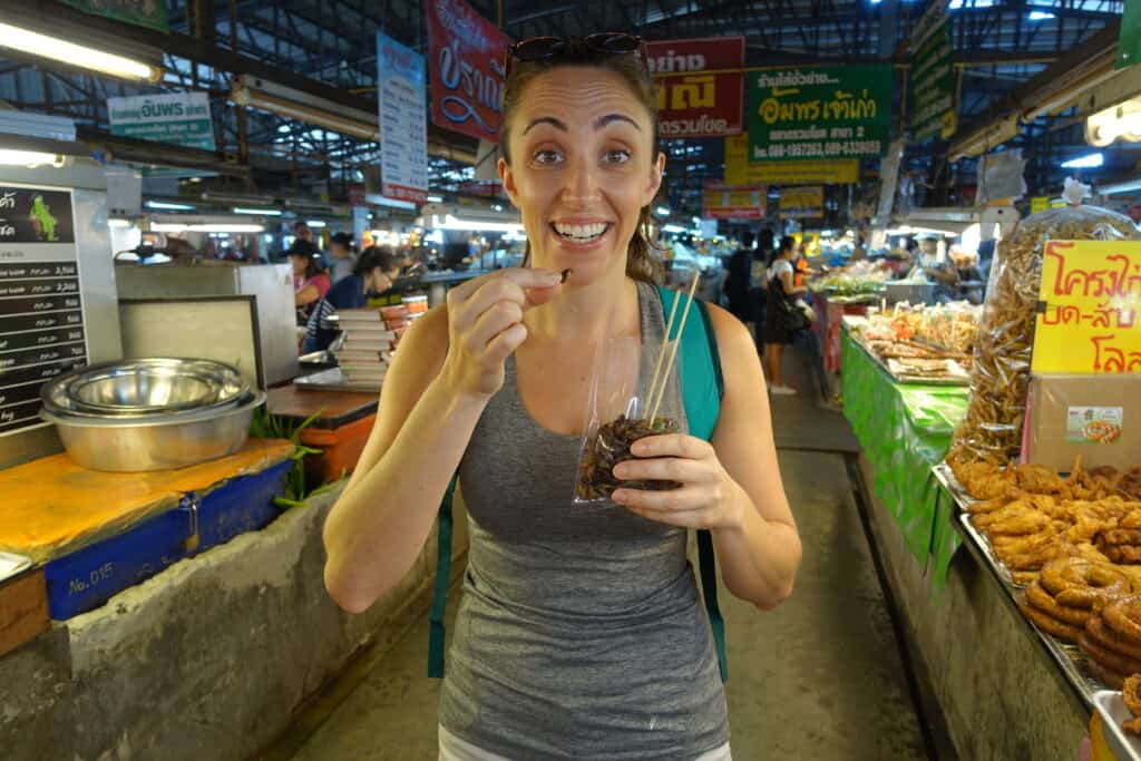 woman holding a bag of crickets