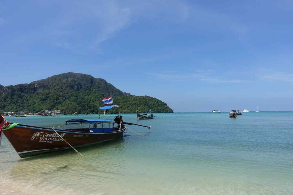 single long tail boat and blue water in thailand 