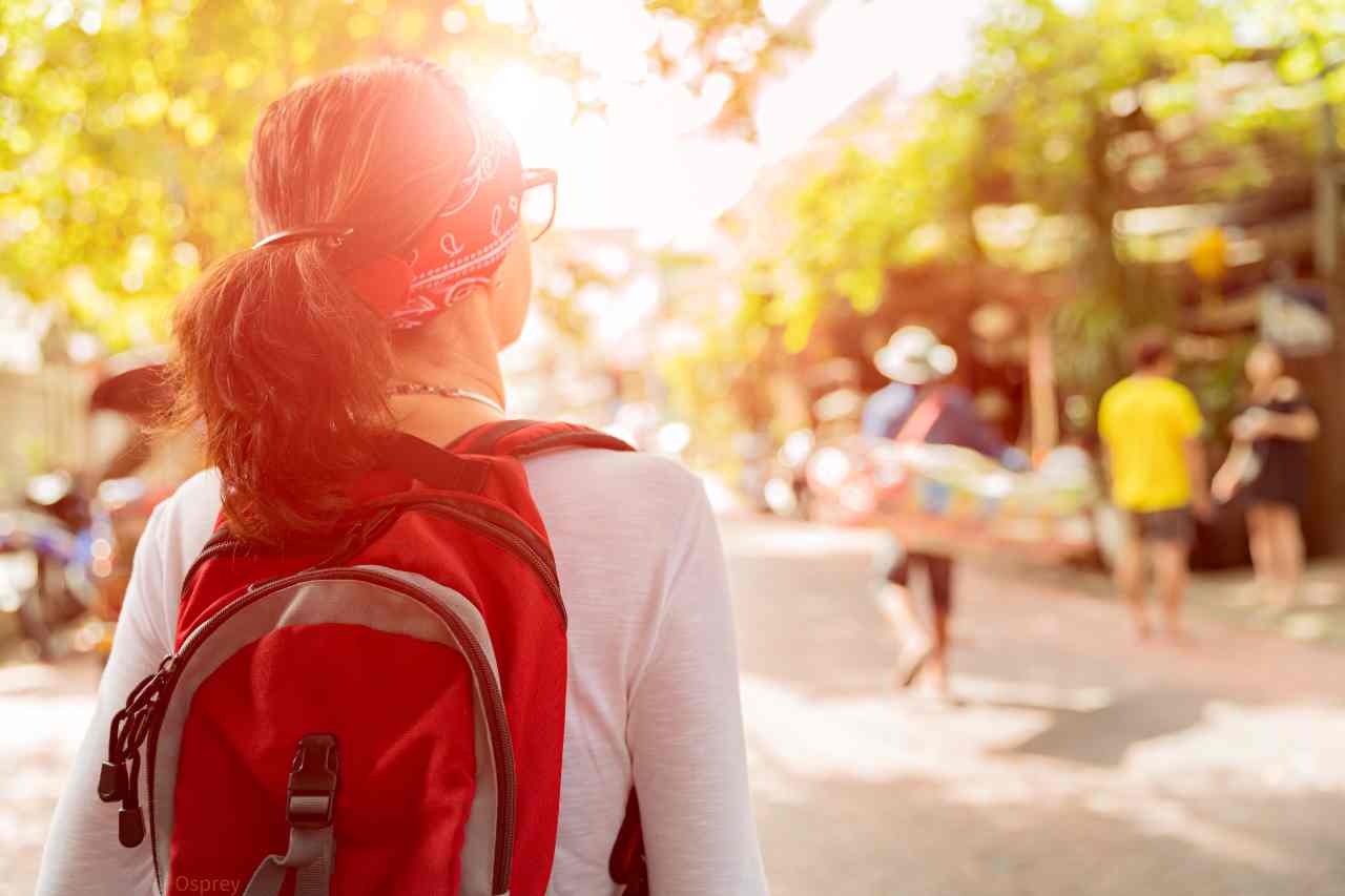 woman wearing a red backpack