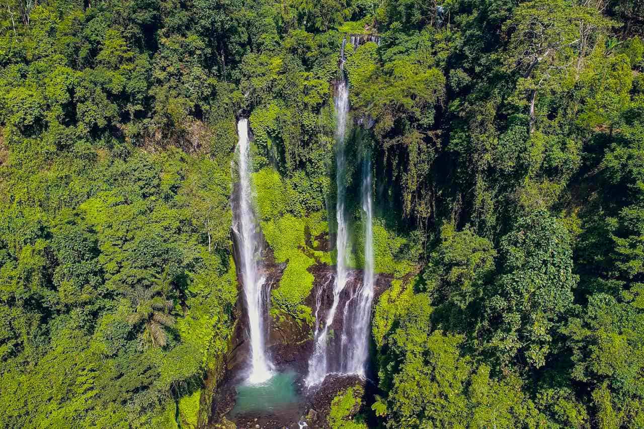 Enchanting Sekumpul Waterfall surrounded by lush jungle in Bali, Indonesia