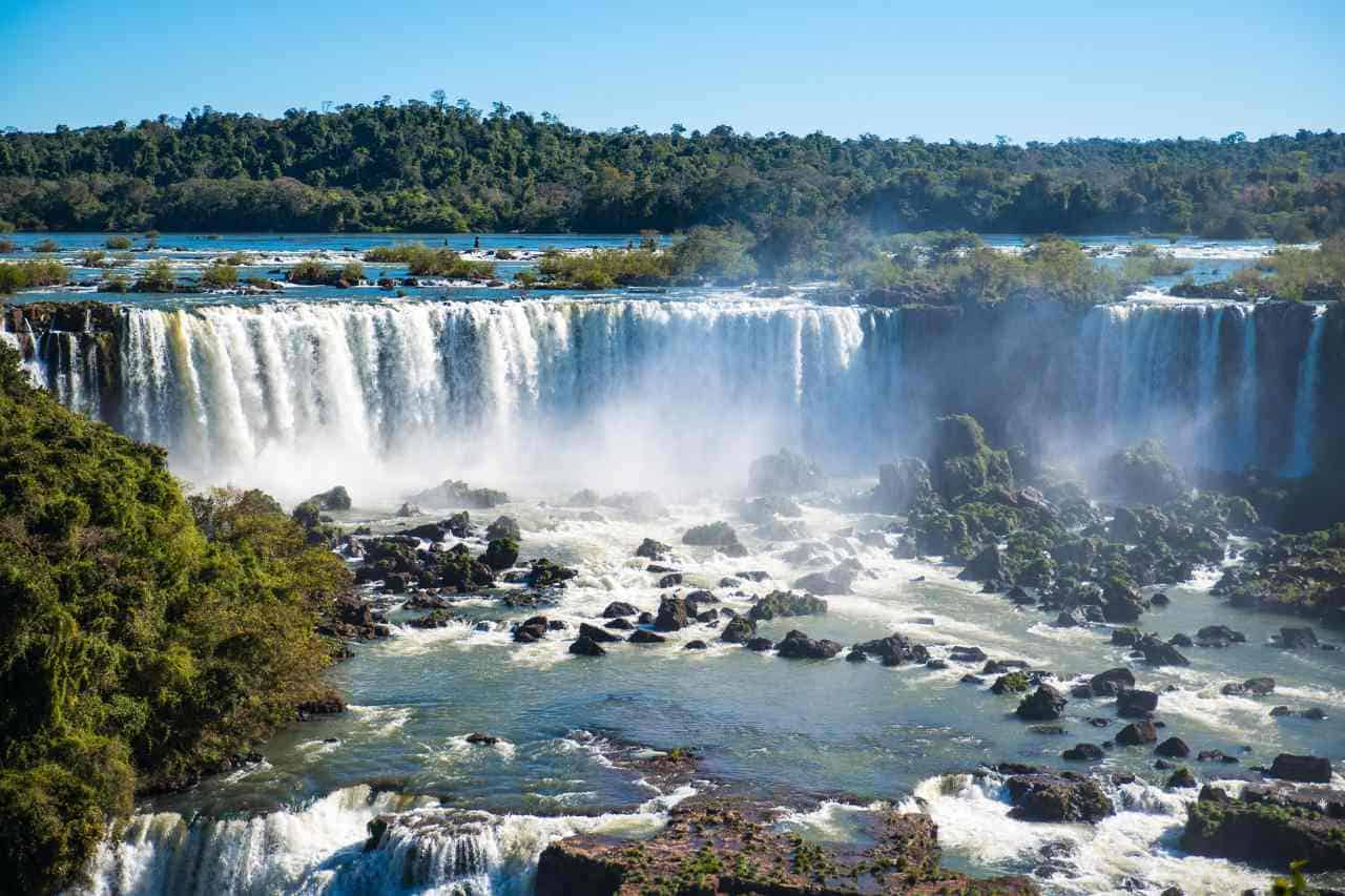 Impressive Iguazu Falls spanning Argentina and Brazil, with thunderous waters and mist