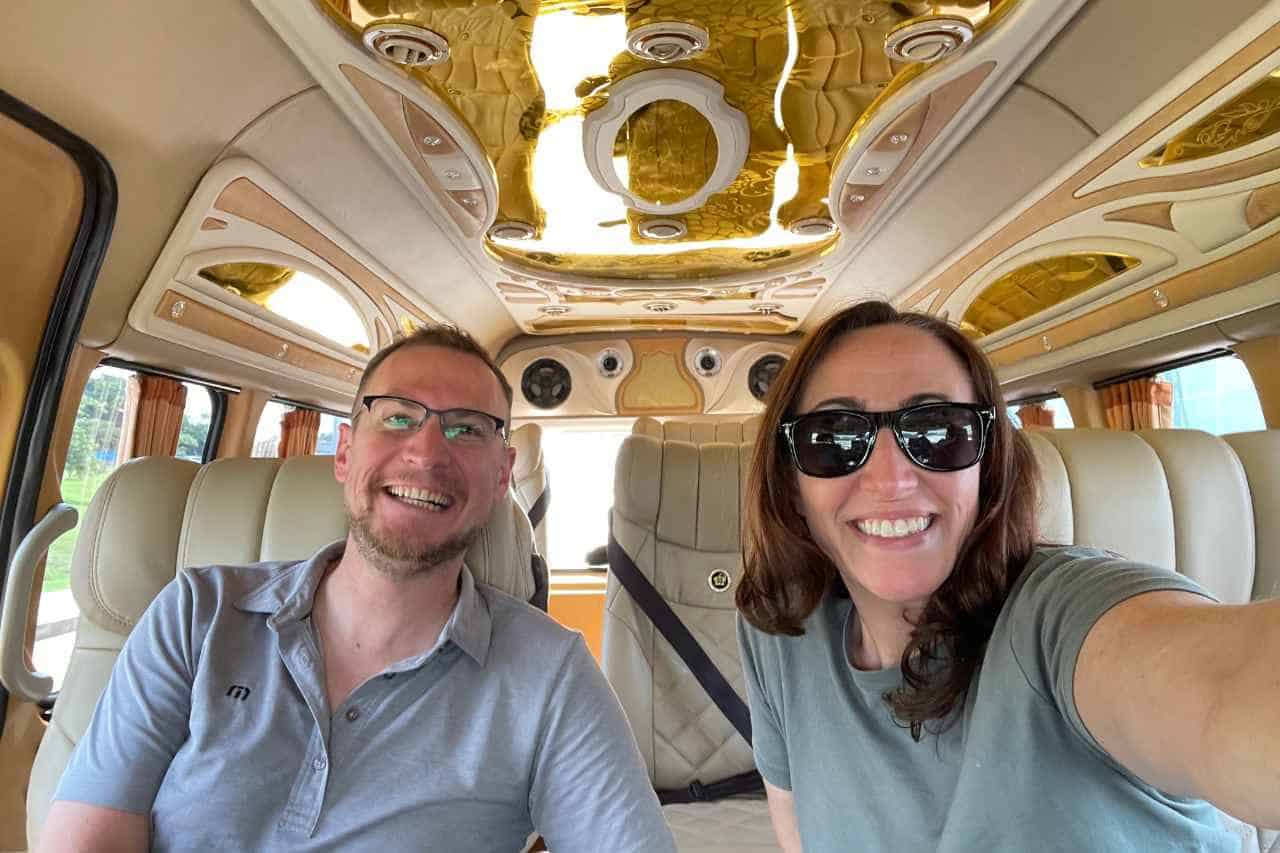 two people in a gold taxi on the way from phuket to krabi