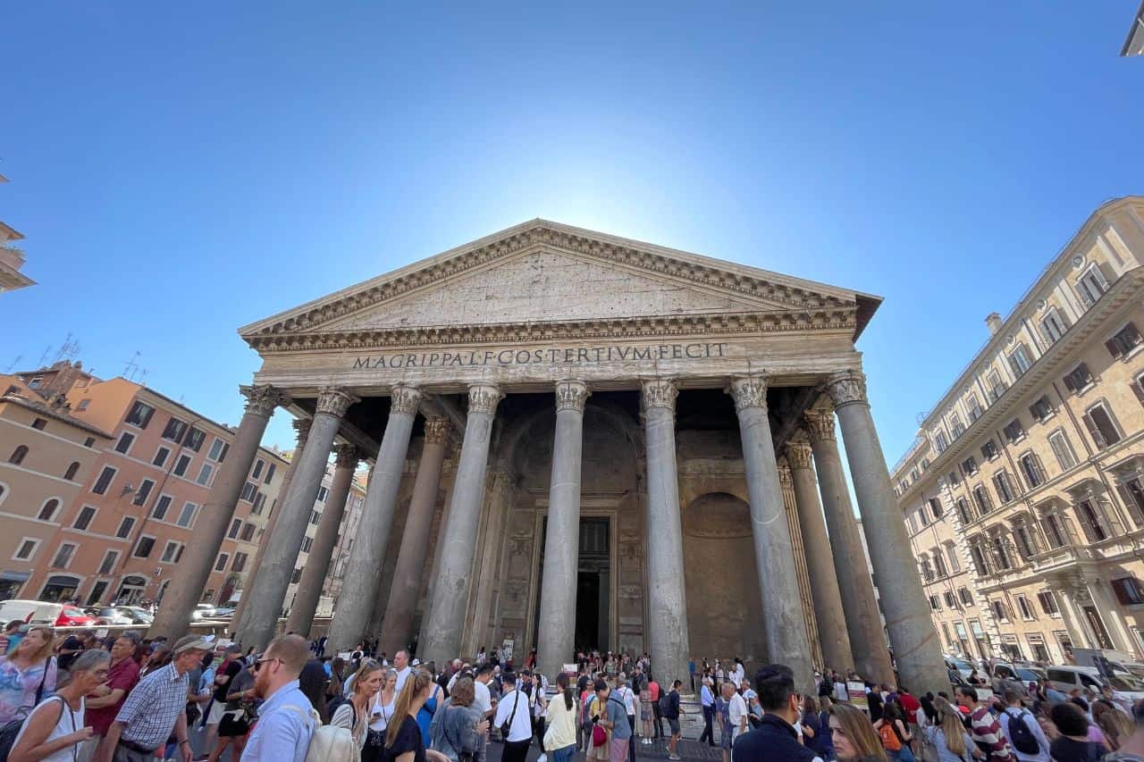 exterior of the pantheon in italy with many tourists outside