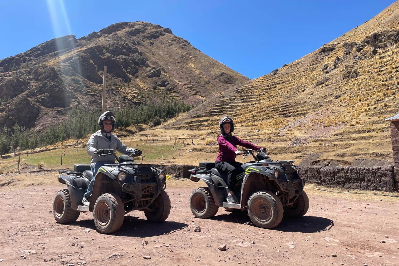 two people on atv's in peru