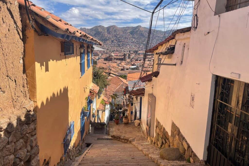 looking down a stone staircase in Cusco