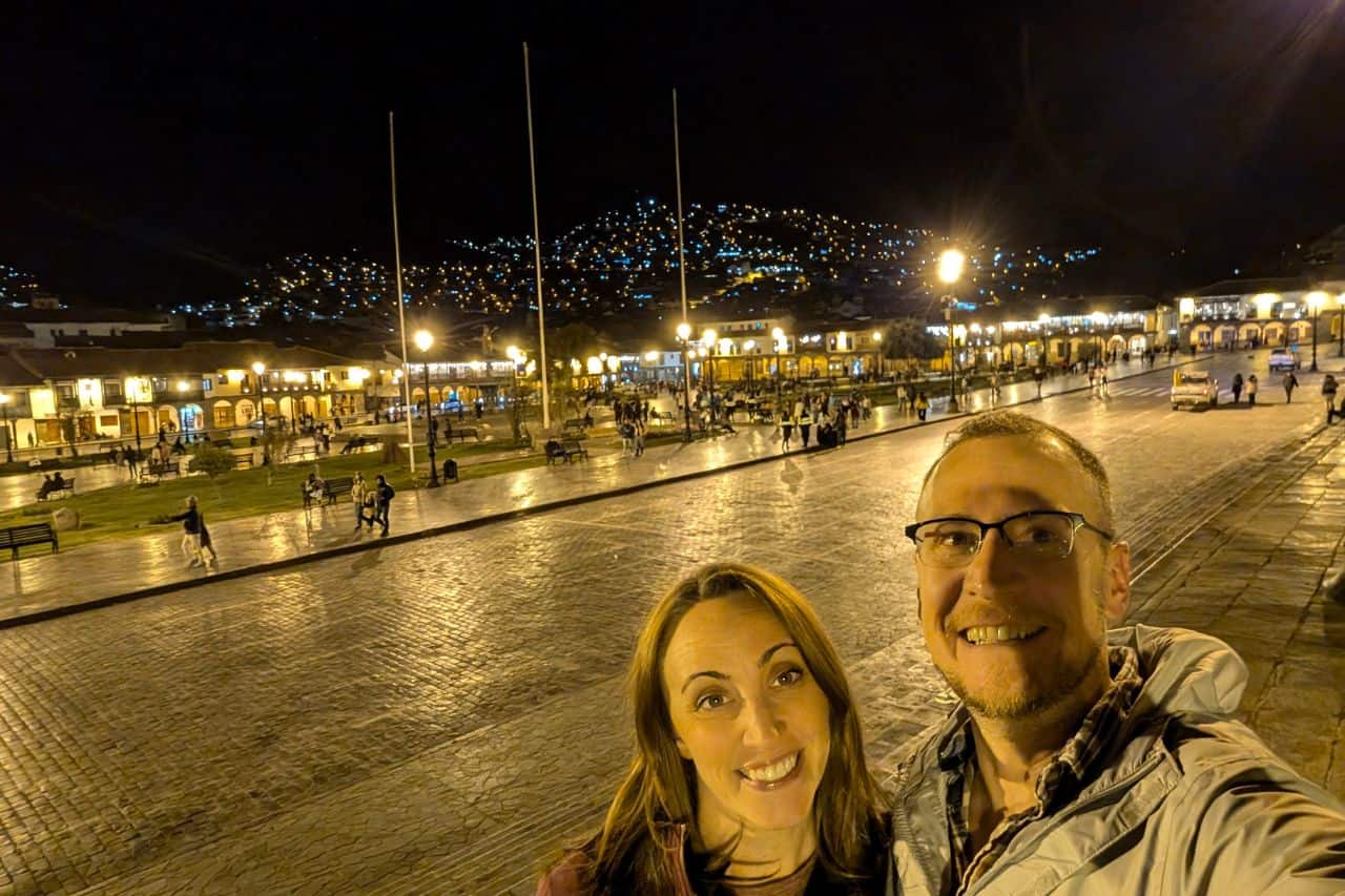 couple taking a selfie at nightime in the Cusco plaza