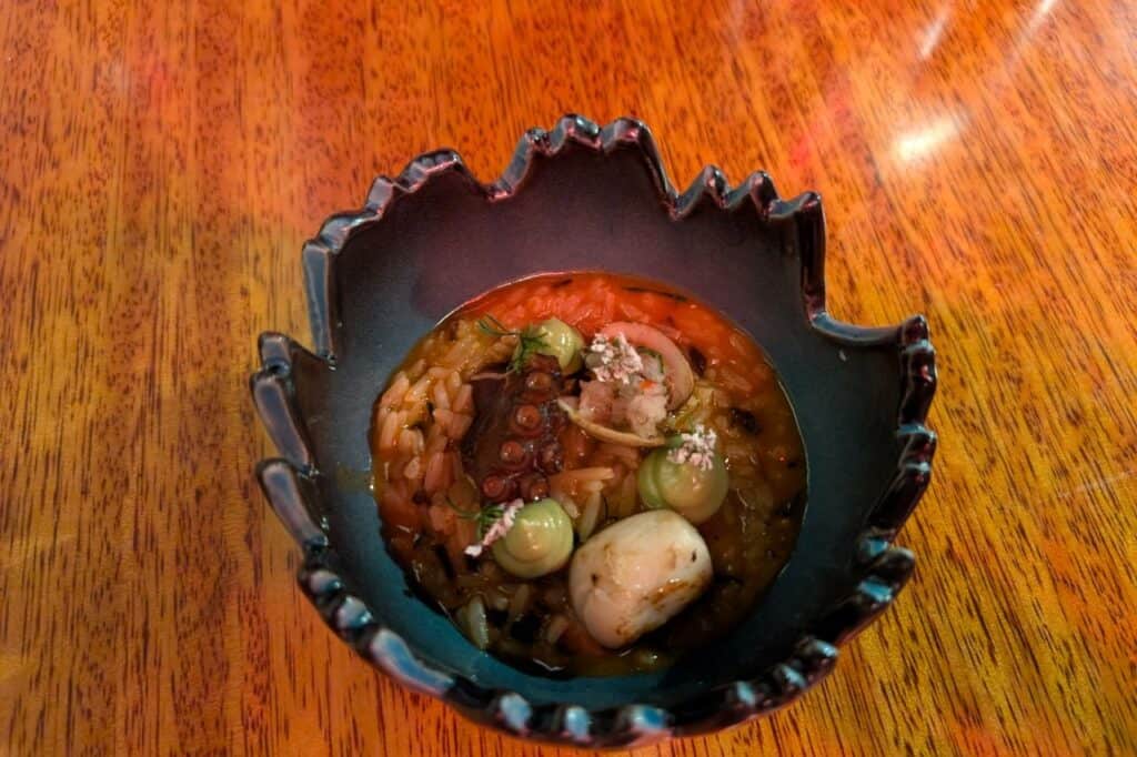 warm rice and vegetables inside of a grey marble bowl