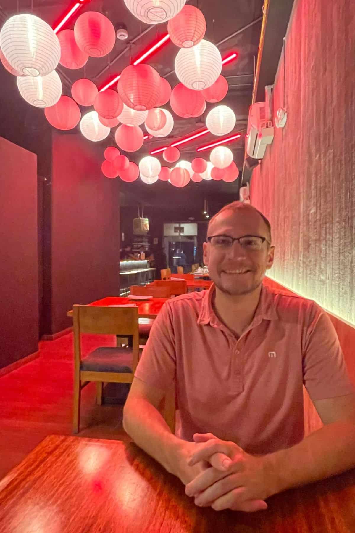 man sitting inside of Gaijin Cocina Nikkei