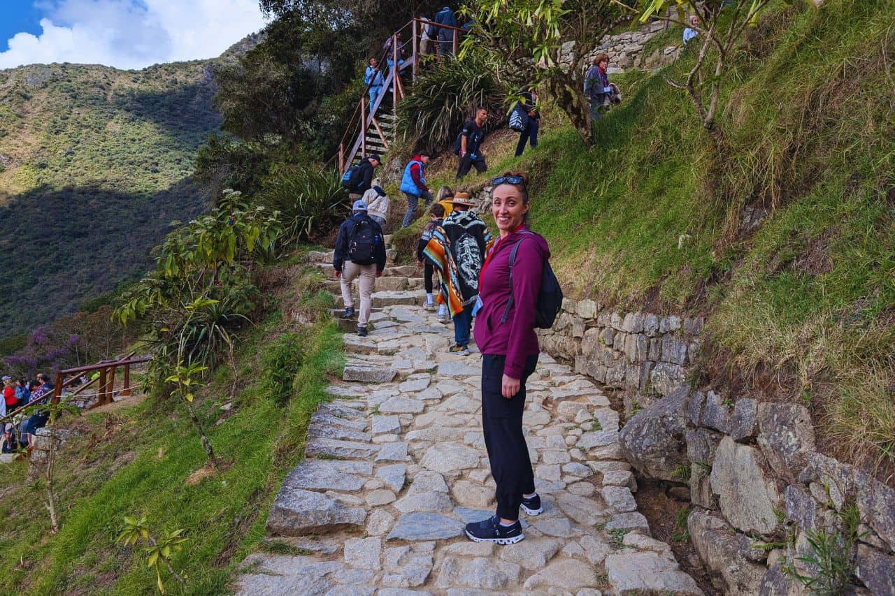 Tourists exploring Machu Picchu in perfect weather