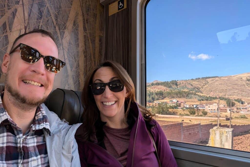 Travelers enjoying mountain views on Peru trains from Cusco to Aguas Calientes