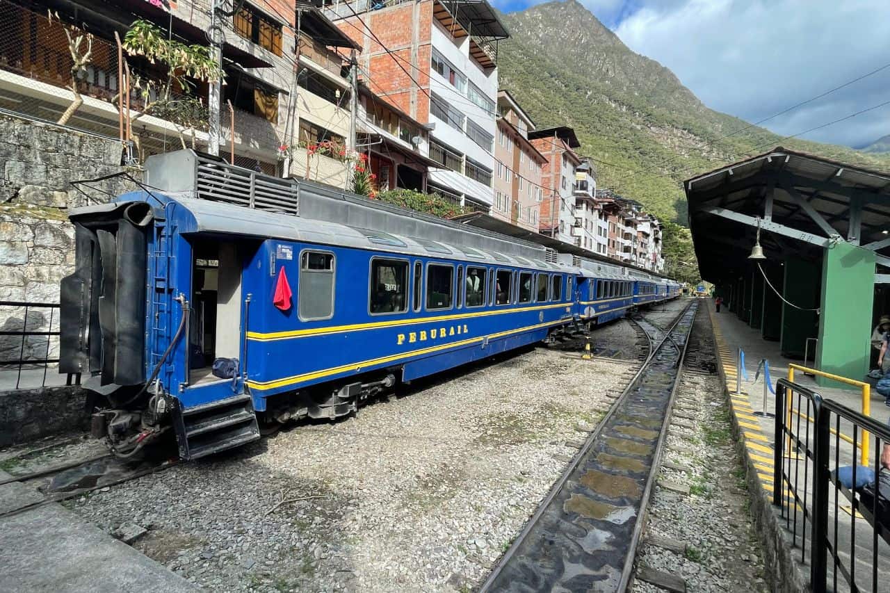 Scenic train arriving at Aguas Calientes station near Machu Picchu