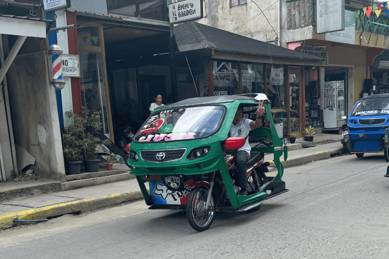 A green Tricycle in El Nido Palawan