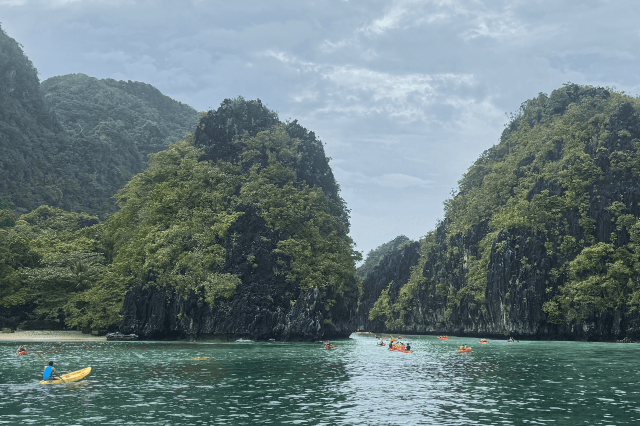 Tourists kayaking in the Big Lagoon, El Nido