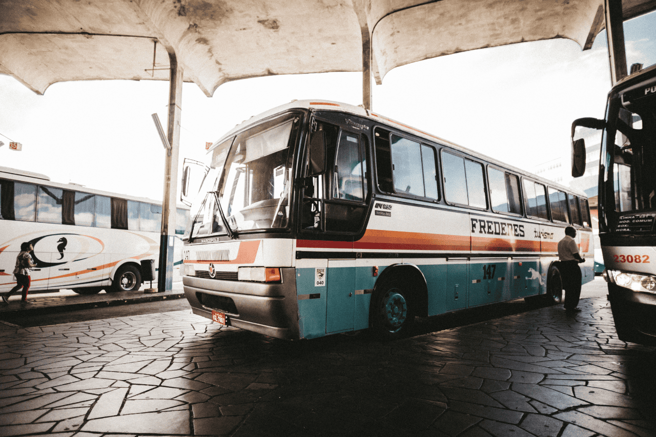 A modern long-distance bus traveling from Singapore to Kuala Lumpur at the bus terminal