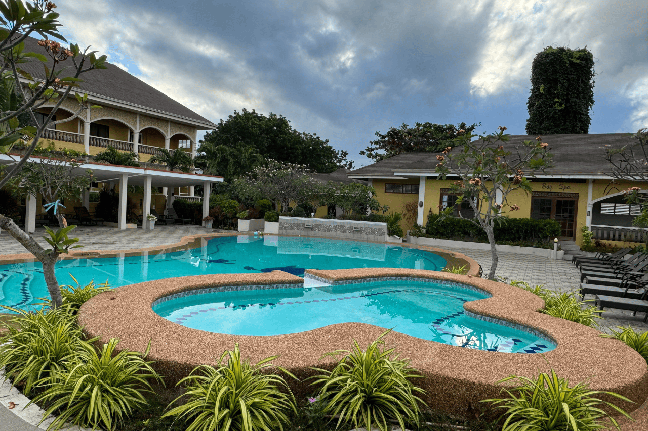 Relaxing poolside area at Turtle Bay Dive Resort, a top-rated hotel in Moalboal for divers and travelers