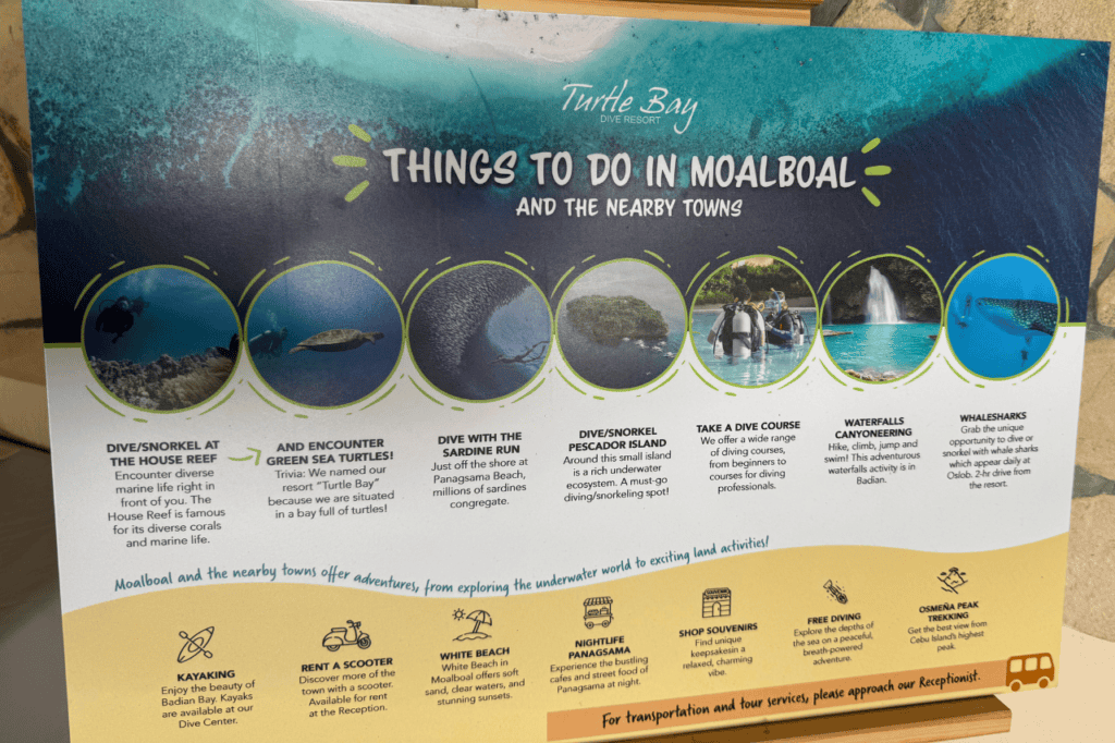 Sign listing all of the things to do in Moalboal