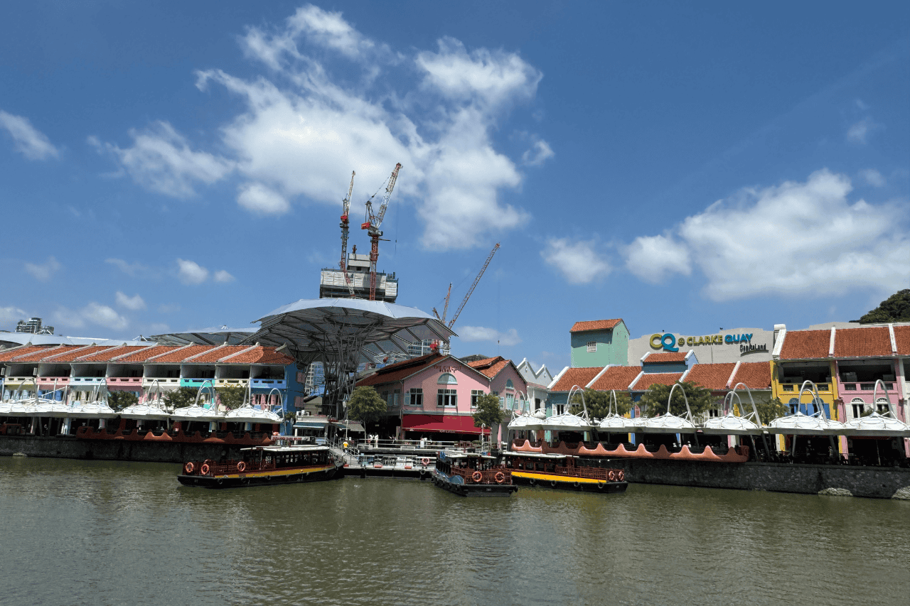 Clarke Quay’s colorful riverside restaurants and nightlife, a top destination to explore during the best times to travel to Singapore.