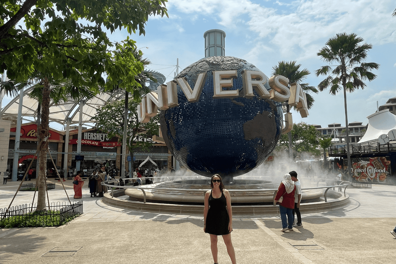 Woman standing in front of the Universal Singapore sign