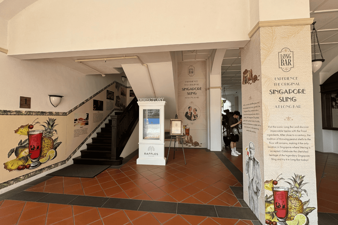 The entrance to long bar outside the historic colonial-style Raffles Hotel - one of the unique travel places in Singapore