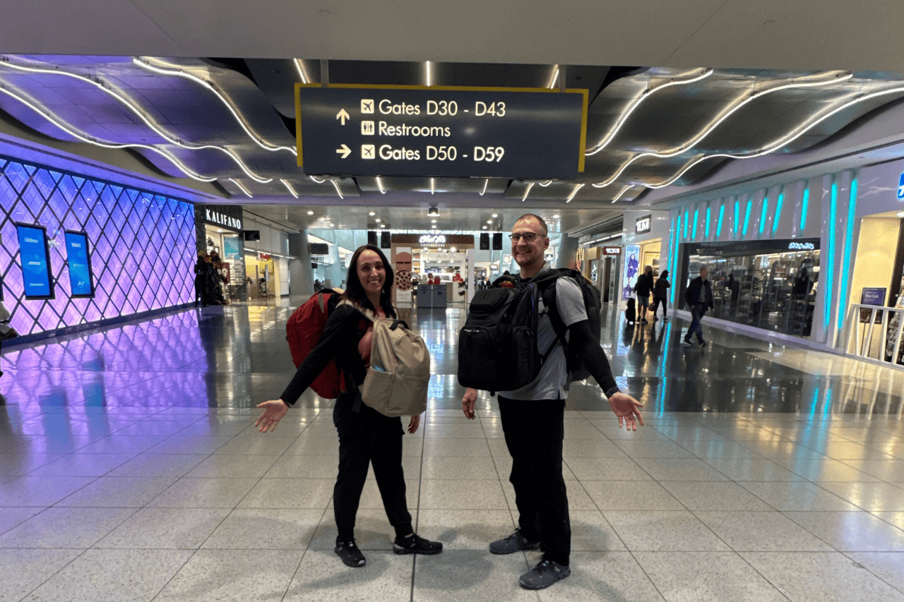 Two travelers with backpacks – why having travel insurance for Singapore is essential for a worry-free trip.