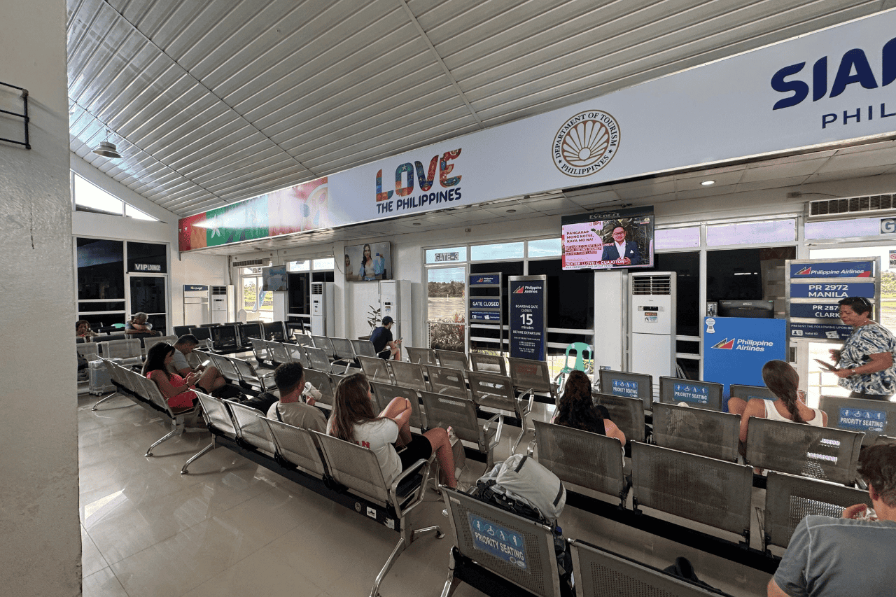 Inside the airport at Siargao terminal with travelers waiting for their flights