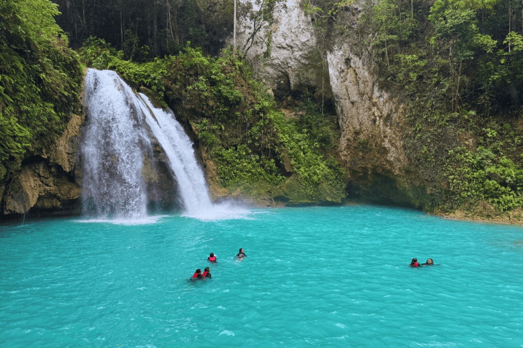 Crystal-clear blue waters of Kawasan Falls