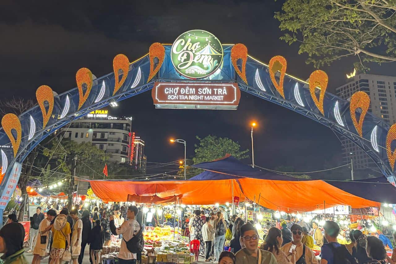 Colorful archway lit up at night marking the entrance to Son Tra Night Market near the Da Nang bridge area