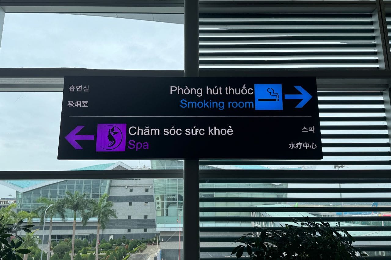 Terminal Signage for Spa and Smoking Room - Da Nang Airport Multilingual terminal sign at Da Nang Airport directing passengers to spa and smoking room areas