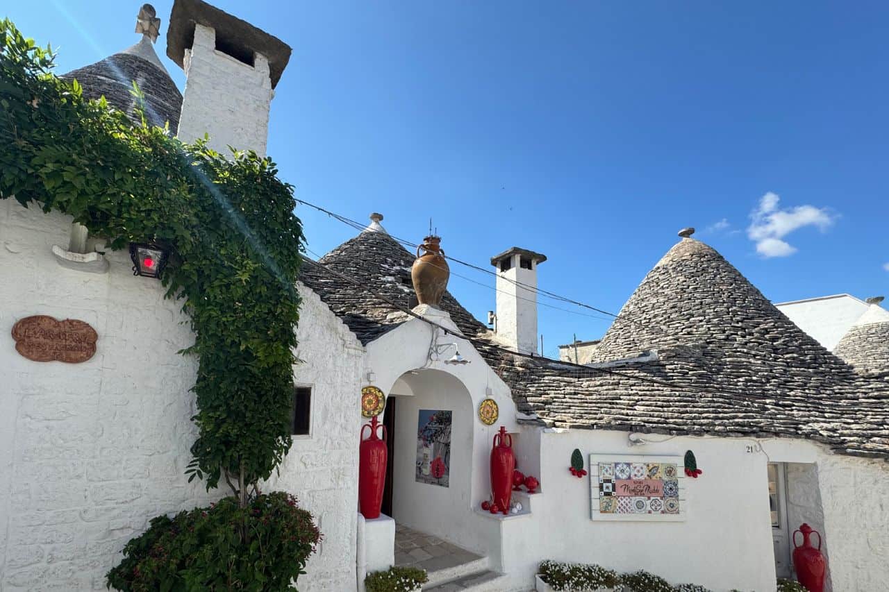 Close-Up of a Trulli House in Alberobello Detailed view of a white Trulli house with a pointed stone roof in Alberobello