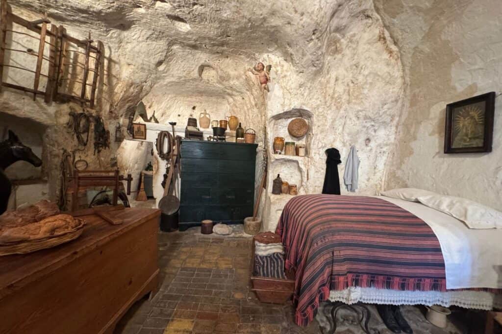 Traditional stone cave home in Matera’s Sassi district, showcasing historic architecture and narrow streets